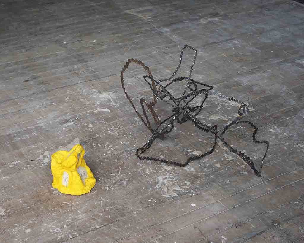 Yellow paper mache work 22 x 18 x 21cm. Chain reactions, chainsaw chain and weld. 66 x 38 x 67cm