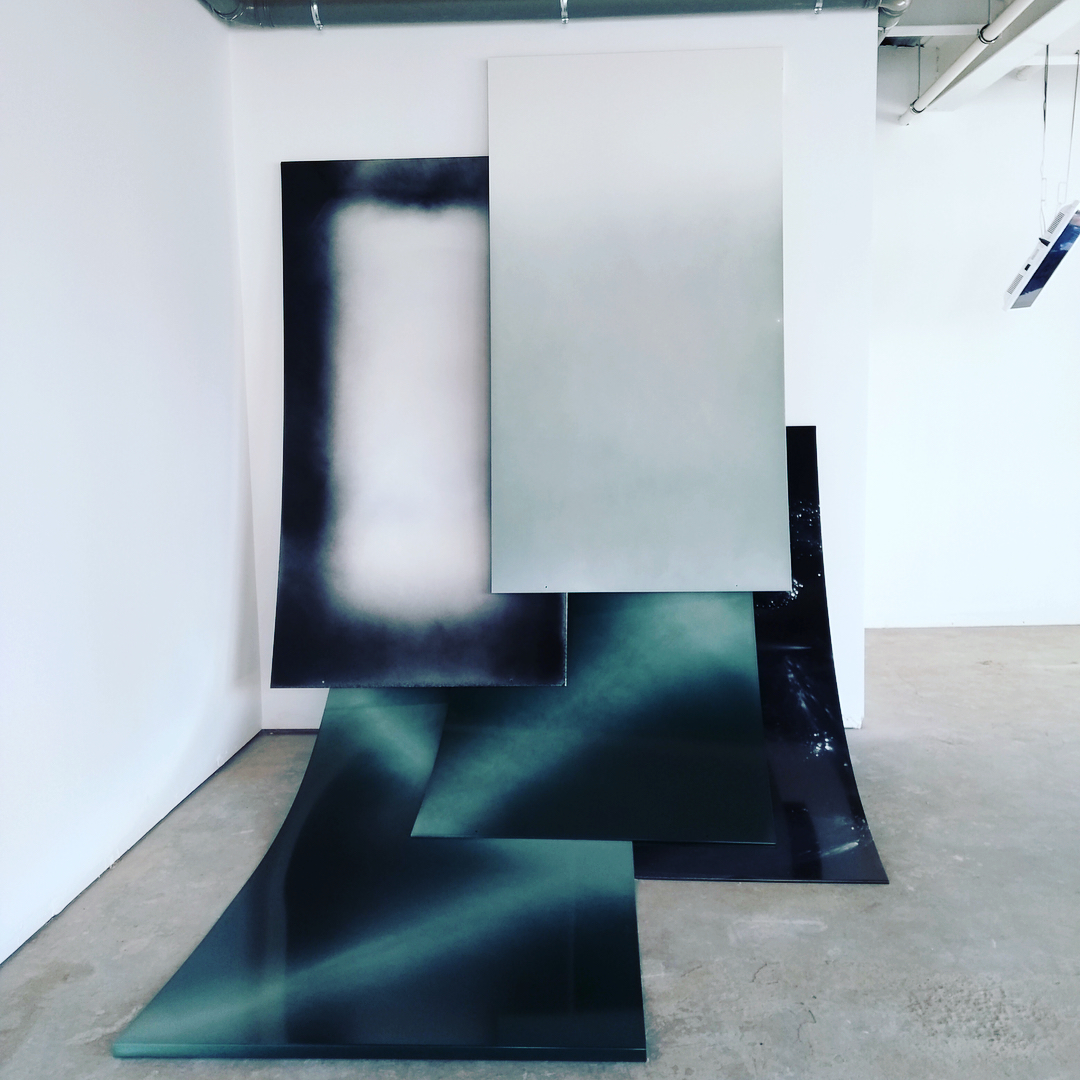 Installation view of five out of fourteen industrial powder coated paintings developed and produced in collaboration with Ritherdon Ltd paint shop staff using experimental application techniquesImage courtesy of Super Slow Way and The National Festival of Making 